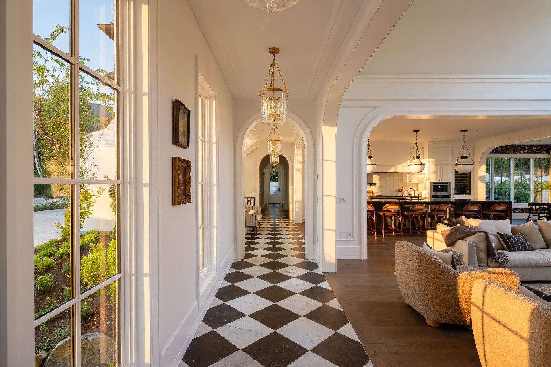 Bright entry hall with a checkerboard floor and arched doorway